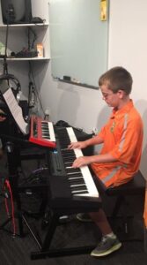Bach to Rock student Joey P playing keyboard