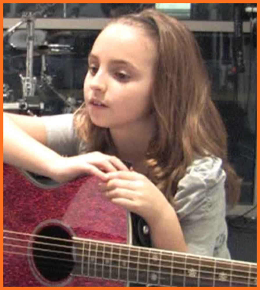 ></p>
<p ><b>Paige P</b> is Bach to Rock’s Student of the Month for January 2013. She attends B2R South Riding, Virginia. Aaron Sefchick is Paige’s instructor for private guitar lessons. In addition to the guitar, she enjoys singing and writing her own songs. The background music for this video contains portions of an original song written by Paige.</p>
<p><iframe loading=