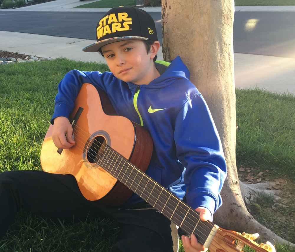 ></p>
<p>Dayton is a 9yr old student in Rocklin. He enjoys school, soccer, photography, movie making, and as his hat suggests, Star Wars.</p>
<p>His mom says since discovering a passion for guitar he's rarely without his – practicing, playing for friends, and filling his time with music. </p>
			</div><!-- .entry-content -->
		</article><!-- #post-->
	</div>

										
					<div class=