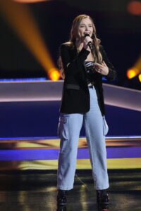 Performing during blind auditions.