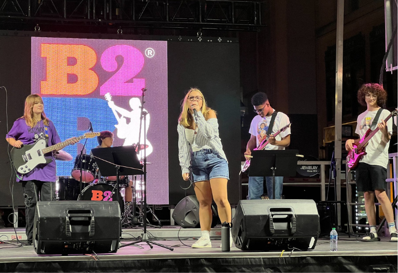 bach to rock student band performing on stage